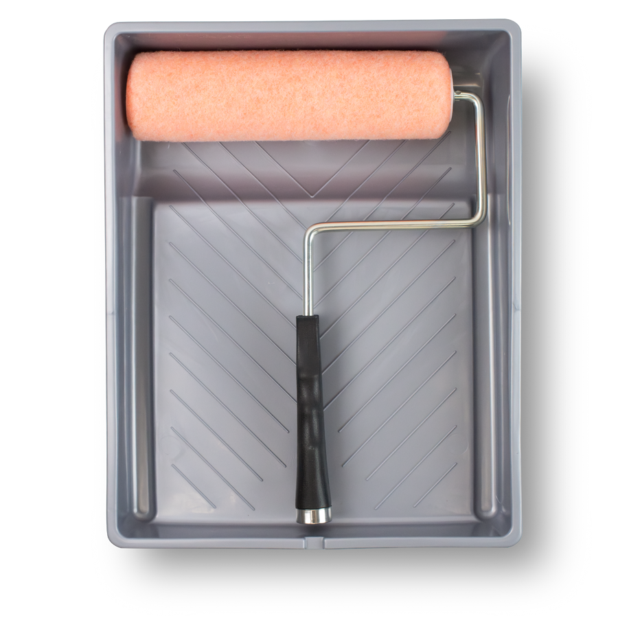 a pink paint roller with a black handle lays inside a gray paint tray against a white background