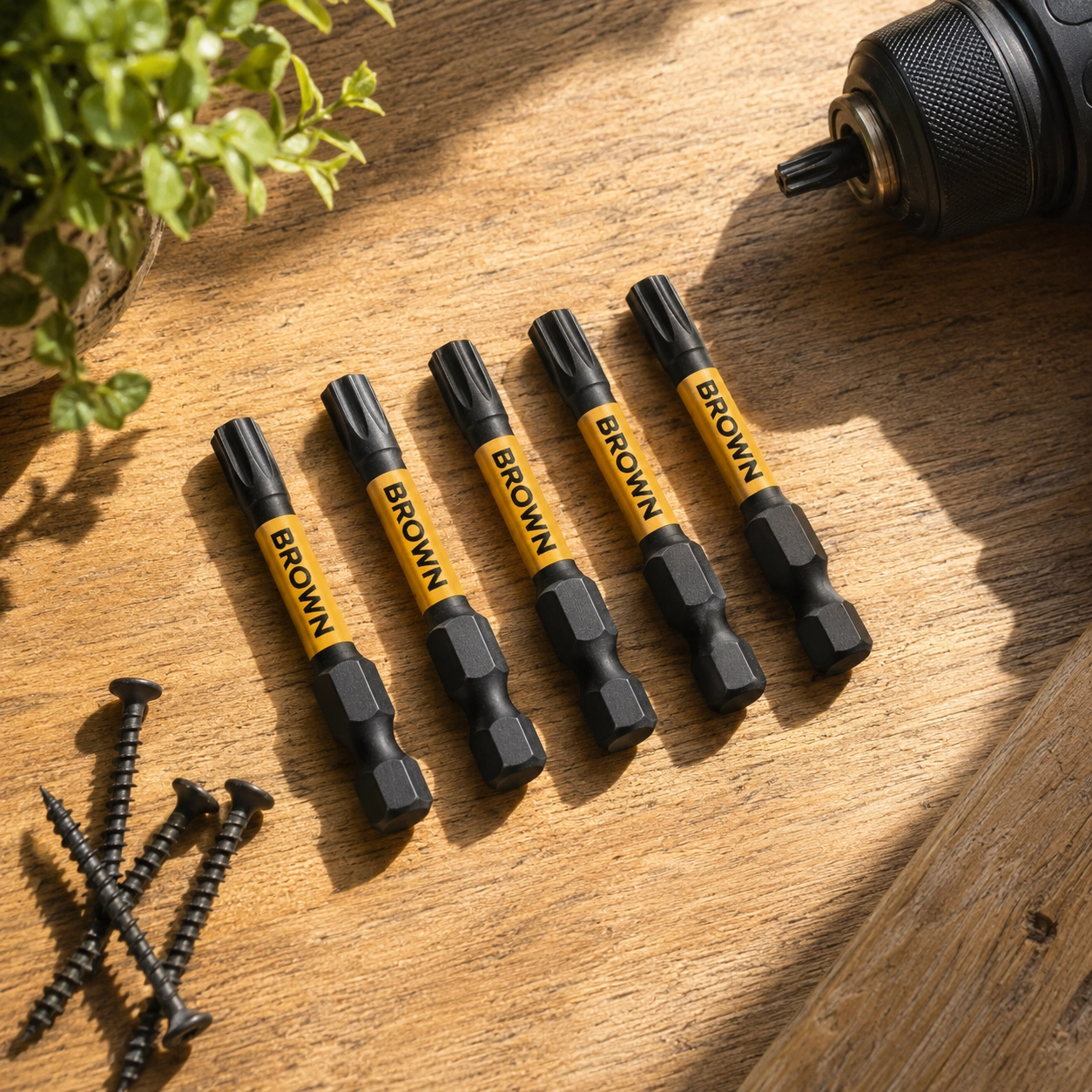 Yellow Brown brand power drill bits on wooden boards